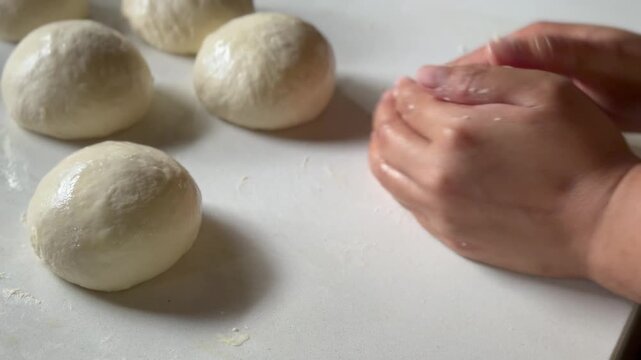 Preparation homemade pizza on kitchen table