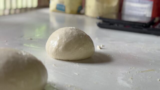 Preparation homemade pizza on kitchen table