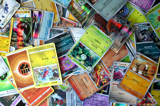 Assorted Pok&eacute;mon trading cards representing the booming collectibles market, trading card economy, gaming industry, investment trends.