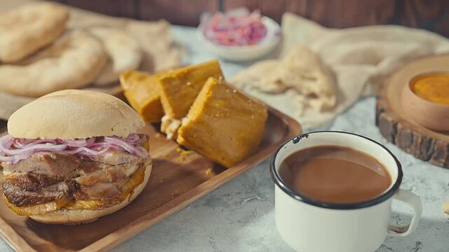 Traditional Peruvian Breakfast with Chicharron Pork Sandwich Tamale and Coffee