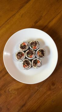 4K Top View Video of Korean Bulgogi Kimbap Rice Rolls with Beef and Vegetables for Korean Cuisine and Food Documentary Footage