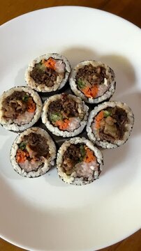4K Top View Video of Korean Bulgogi Kimbap Rice Rolls with Beef and Vegetables for Korean Cuisine and Food Documentary Footage
