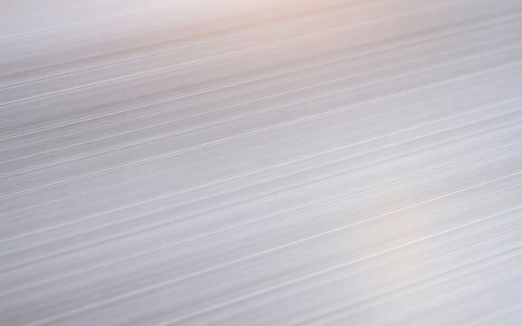 Abstract background of brushed metal texture with horizontal parallel lines