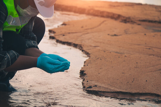 Water quality technicians collecting samples from natural sources to support environmental monitoring.