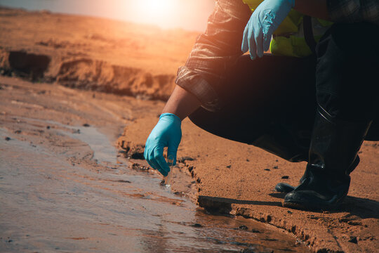 Water quality technicians collecting samples from natural sources to support environmental monitoring.