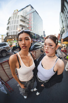 Portrait of authentic Gen Z asian woman identity self street fashion multicultural with asscessories standing at outdoor