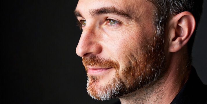 Close-Up Portrait of a Man with a Thoughtful Expression in Soft Lighting