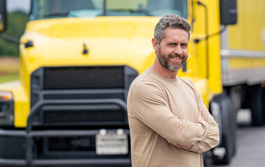 Man owner truck driver. Transportation industry. Man driver near lorry truck. Truck driver smiling. Trucking owner. Transportation vehicles. Hispanic man in front of truck. Semi trucks vehicle
