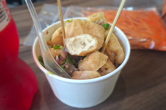 tahu gejrot indonesian food. cup of ripped tofu. traditional delicious food made from tofu