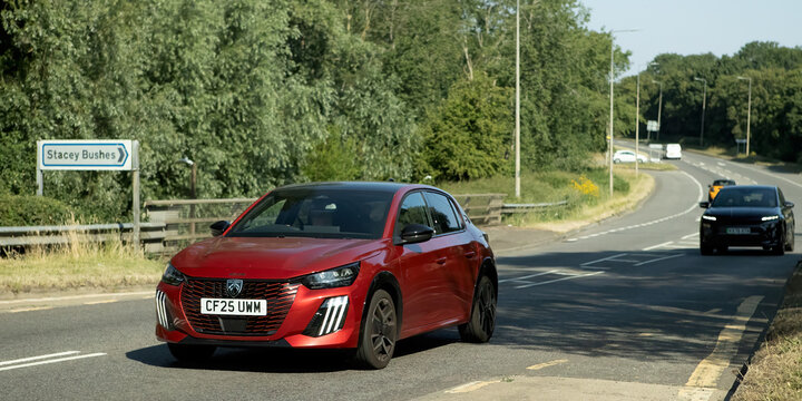 Milton Keynes,Bucks,UK - July 9th 2026: 2025 red Peugeot 208 gt car driving on a British road