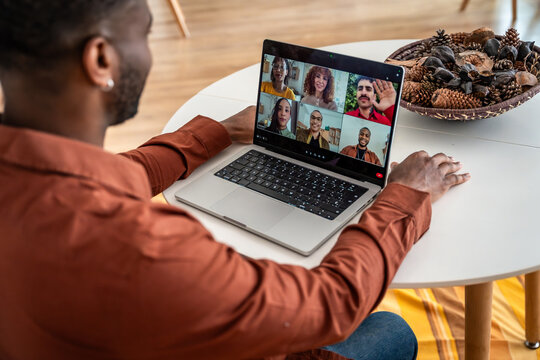 Man participating in online group therapy session