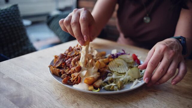 Girl Dips Fries In Sauce Enjoying A Plate With Grilled Kebab Meat And Vegetables