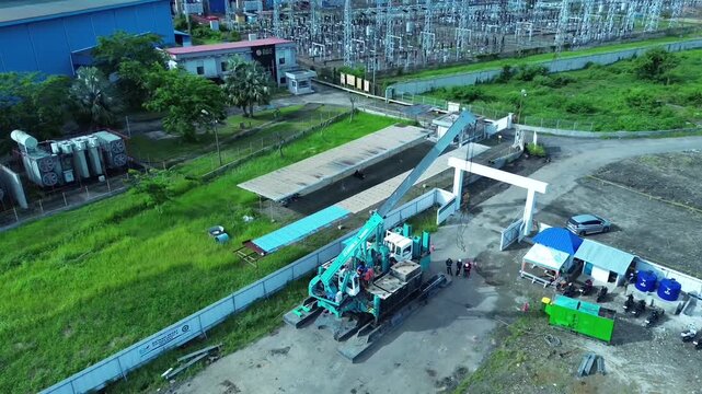 Aerial View of Active Pile Driving Rig Construction at BBS Power Plant Project