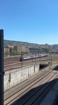Zurich, Switzerland - June 25, 2026: Passenger trains operating near Zurich Central Station during a sunny summer day, showing railway infrastructure and daily transportation in the city. Editorial us