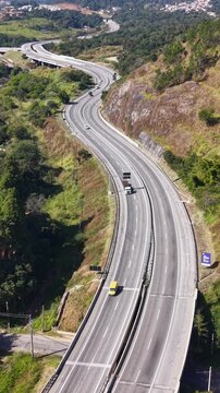 Aerial Drone Shot of a Traffic Flow on a curvy road at Daytime.