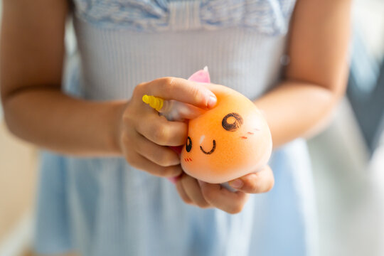 Hands squeeze a soft squishy stress relief toy during sensory play. Tactile interaction promotes relaxation, emotional regulation and stress reduction.