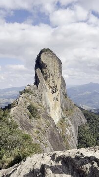 Pedra do Ba&uacute; in S&atilde;o Bento do Sapuca&iacute; in vertical video. Rock climbing site. Atlantic Forrest.