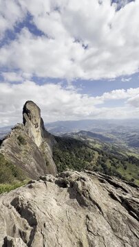 Pedra do Ba&uacute; in S&atilde;o Bento do Sapuca&iacute; in vertical video. Rock climbing site. Atlantic Forrest.