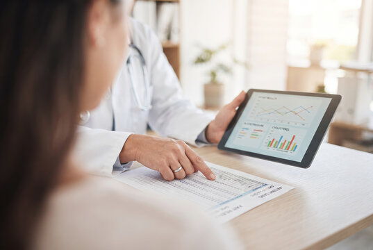 Doctor explaining chart on tablet