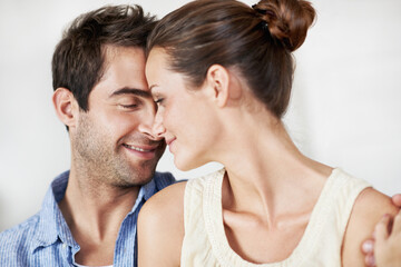 Obraz premium Man, couple and smile with romance in home for bonding together, healthy marriage and connection. Love, trust and happy people with hug in house for affection, forehead touch and care in relationship