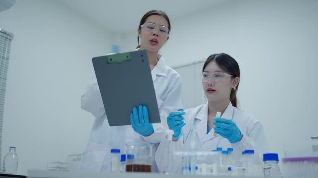 Angry scientist shouting at stressed colleague after a failed experiment in a research laboratory