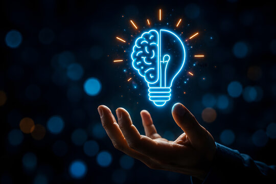 Bright glowing blue neon lightbulb icon featuring a human brain shape inside held by a person hand representing creative thinking innovation intelligence strategy and clever mental ideas for business 