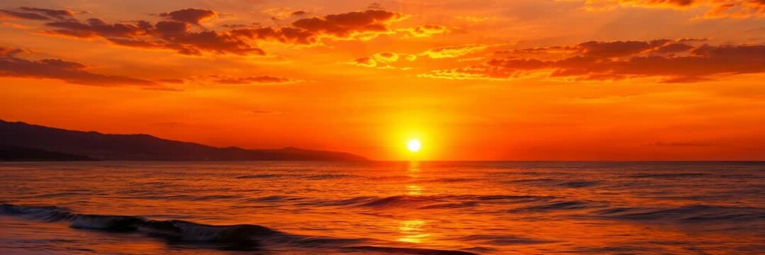 Orange ocean sunset over calm waves, website banner with copy space for text