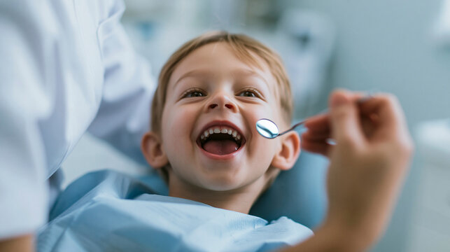 A young child wearing a light blue dental bib, lying in a dental chair.