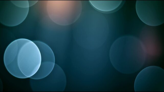 Soft blue bokeh lights pulsing and drifting on dark background, abstract motion background for modern creative design