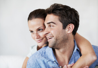 Obraz premium Man, couple and smile with hug in home for bonding together, healthy marriage and connection. Love, trust and happy people with embrace in house for commitment, affection or adoration in relationship
