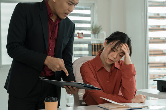 Stressed Businesswoman Reacting to Manager Evaluating