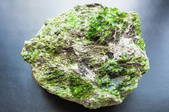 unworked green chrome diopside rock on black