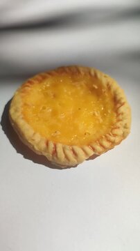 Traditional Balinese pie susu with a sweet creamy milk custard filling, showcasing one of Bali's most popular local snacks.