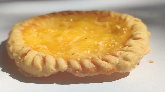 Traditional Balinese pie susu with a sweet creamy milk custard filling, showcasing one of Bali's most popular local snacks.