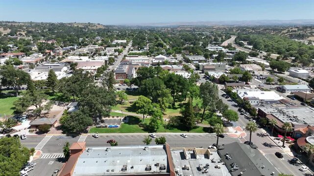 Paso Robles, California, USA - Leftward Aerial Drone View of Downtown, Rolling Vineyards and Central Coast Wine Country Hills