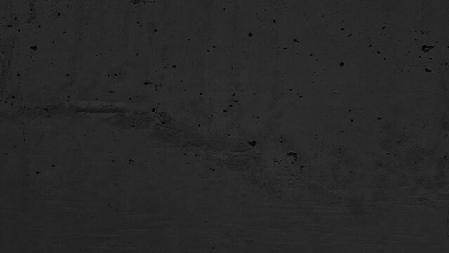 Dark black concrete wall texture background with subtle rough grain, industrial raw cement surface mockup backdrop, abstract dark grey stony texture for moody presentation template copy space.
