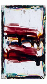 damaged analog film emulsion slowly melting and dripping down a vintage photographic film plate. Thick layers of colorful gelatin emulsion flow downward under gravity, creating organic streaks.