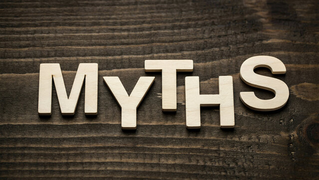 Myths Word Concept with Wooden Letter Blocks on Rustic Background