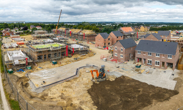 Aerial view above a new build housing construction site in the UK