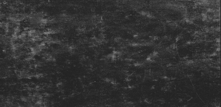Dark chalkboard texture with chalk dust and fine scratches for background.