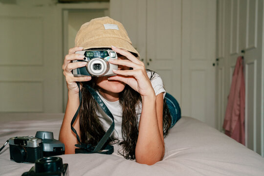 Person Photographing With Point and Shoot Camera