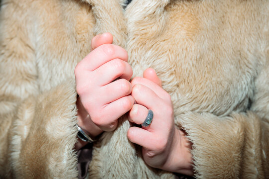 Hands on warm jacket with flash