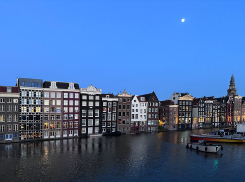 Amsterdam houses along a canal at dusk