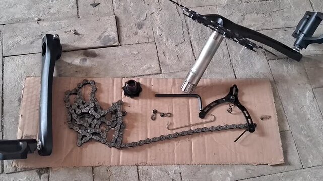 Bicycle repair parts laid out for maintenance motion video footage clip