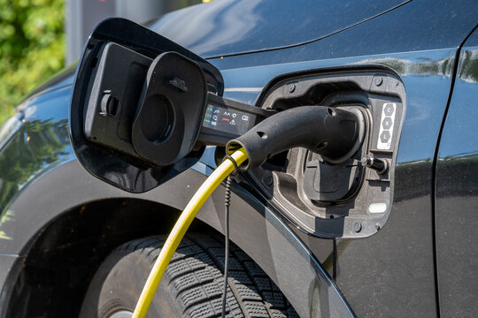 Electric vehicle with charging plug and cable