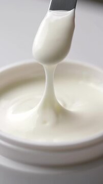 Creamy yogurt texture close-up with spoon