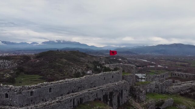 Drone video of Rozafa Castle. Albanian flag. Shkoder, Albania.