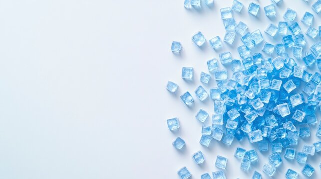 Scattered light blue ice cubes on white background, copy space.