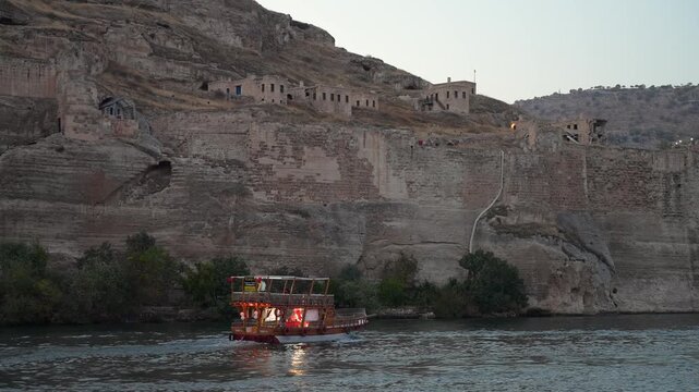 Tourist boat sailing on the Euphrates River in Halfeti, Sanliurfa.