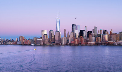 Fototapeta premium NYC night skyline with Manhattan. New York City aerial skyline. New York landscape. NYC metropolis aerial view. New York City skyline with skyscrapers at night. Lower Manhattan skyline.